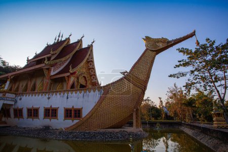 Photo for Scenery The beautiful Suphannahong boat was builted in the pool at Sancomfu temple Chiang Rai Thailand.decorate with gold. This unique style of architecture is often found in traditional Thai art and - Royalty Free Image