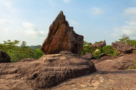Photo for Scenery sunrise at weird shaped rock.These stones have been meticulously formed by nature to create a stunning visual masterpiece.The stones had been carved and shaped into incredible structures. - Royalty Free Image
