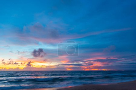 Photo for Scene of colorful pink light trough in the sky above the ocean - Royalty Free Image