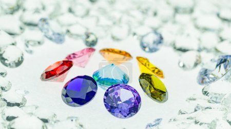 Photo for Colorful diamonds of various sizes are placed in a center circle on white diamonds background - Royalty Free Image