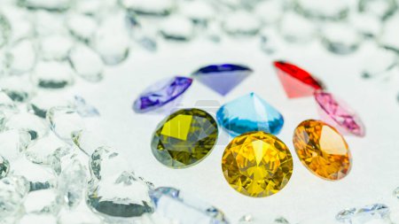 Photo for Colorful diamonds of various sizes are placed in a center circle on white diamonds background.The diamonds are of the highest quality and cut, making them a perfect choice for any special occasion - Royalty Free Image