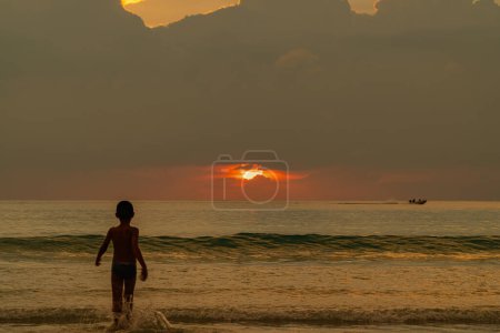 Photo for Scene romantic sunset at Karon beach. abstract nature background.Sunset with bright color light rays and other atmospheric effects.Gradient color.cloudscape background. - Royalty Free Image