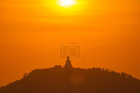 Photo for Yellow sunset sky and Phuket big Buddha. Phuket, Thailand - Royalty Free Image