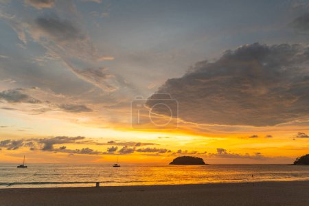 Photo for Sunset over sea with stunning yellow sky - Royalty Free Image