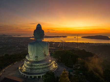 Photo for Aerial view scenery yellow light at horizon at sunrise in front of Phuket Big Buddh - Royalty Free Image