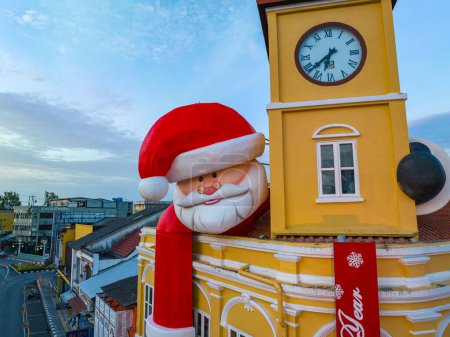 Photo for Phuket,Thailand-December,31,2023: decoration Santa Claus over the ancient building that are beautiful in architecture - Royalty Free Image