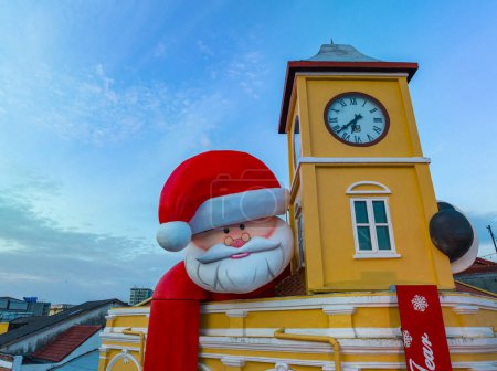 Photo for Phuket,Thailand-December,31,2023: decoration Santa Claus over the ancient building that are beautiful in architecture - Royalty Free Image