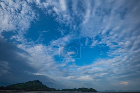 Photo for White clouds in the blue sky The sun shines through. - Royalty Free Image