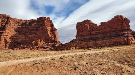 This stunning photo captures the rugged beauty of the desert and massive Red Rock Formations in Moab, Utah. 