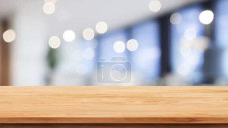 Empty wooden table over blurred coffee shop or office background, product display montage