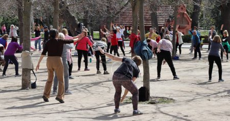 Photo for Madrid - Spain - March 13, 2024.Outdoor physical activity for older people. Older adults doing exercise at Madrid Retiro park. - Royalty Free Image