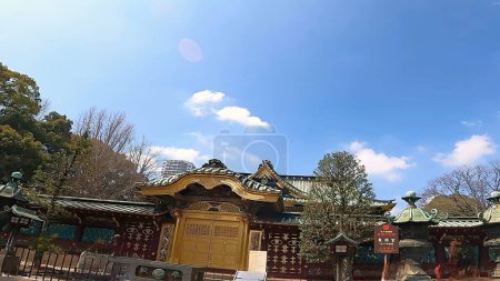 Photo for Ueno Toshogu shrine building blue sky roof clouds UenoThe approach to Ueno Toshogu Shrine in Ueno Park, Tokyo, Japan - Royalty Free Image