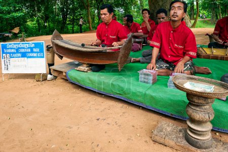 Photo for Landmines victims performing music at Banteay Srey Temple. Siem Reap Cambodia - Date: 13 - 08 - 2023 - Royalty Free Image