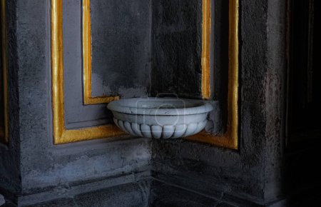 Photo of a holy water font or stoup, material marble, interior of The Temple of Nuestra Seora del Carmen is better known as the Templo del Carmen in Mexico City