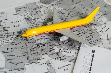 map of europe, airplane, letter