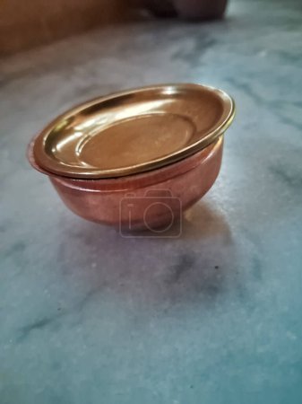Small copper pot insolate in white background.