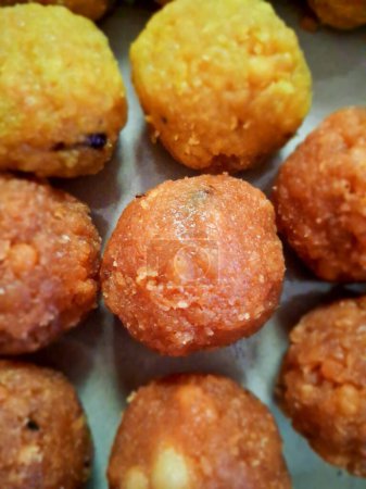 Home-made Indian sweet- delicious laddu.Laddus are made of flour, fat, and sugar, with other ingredients that.