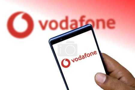 Photo for Dhaka, Bangladesh - 11 December 2023:Vodafone logo of a multinational telecommunications company from the United Kingdom "Vodafone" on a cellphone screen. - Royalty Free Image