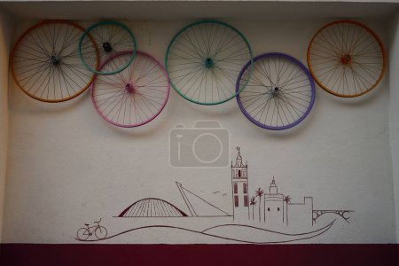 Photo for Bicycle wheel on a wall - Royalty Free Image
