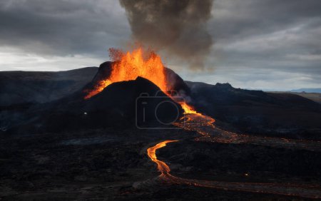 Volcanic eruption explosion and lava flow in the lava field of Fagradalsfjall, Geldingadalir,  Reykjanes Peninsula, Iceland
