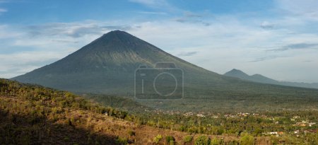 Scenic view of mount Agung volcano and Purwakerti village in touristic area of Amed in Bali during early morning sunlight