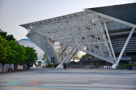 Photo for Seoul, South Korea - June 2, 2023: Wide shot of the KSPO Dome, the former '88 Olympics gymnastics facility, now hosting UFC events, Esports contests, and concerts, featuring a white wire mesh awning. - Royalty Free Image