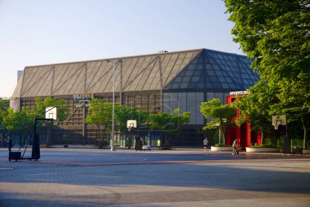 Photo for Seoul, South Korea - June 2, 2023: The Woori Financial Art Hall, formerly an Olympic weightlifting arena, now transformed into a performance hall, with basketball courts in the foreground. - Royalty Free Image