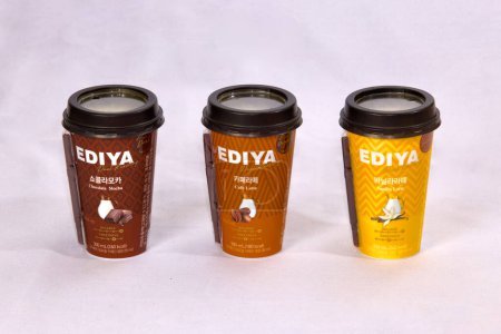 Photo for Ulsan, South Korea - January 14, 2024: A delightful trio of Ediya bottled coffees, including Chocolate Mocha, Cafe Latte, and Vanilla Latte. Ediya, a renowned Korean coffee chain, offers these rich and flavorful coffee options in convenient to-go cup - Royalty Free Image