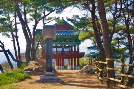 Photo for Gumi City, South Korea - November 17th, 2023: A view featuring a stone marker in the foreground, with the historic Gwansuru Pavilion and surrounding pine trees elegantly positioned in the background. - Royalty Free Image