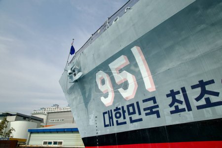 Photo for Ulsan, South Korea - March 17th, 2024: The hull of the Ulsan Frigate, marked with the number 951 and the inscription "Korea's First Frigate" in Korean, proudly displayed at the Jangsaengpo Whale Museum, commemorates its historic significance in South - Royalty Free Image