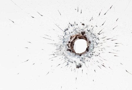 Big hole in cracked window on white background. Broken glass texture for design.
