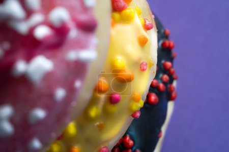 Abstract background with colorful donuts. Icing and sprinkles.