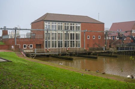 Old water pumping station in Neuharlingersiel, Germany for drainage of the surrounding inland fields into the North Sea