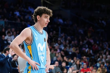 Photo for Player of Movistar Estudiantes seen in action during the LEB Oro Match between Movistar Estudiantes and Cantabria at WiZink Center. December 3 - Royalty Free Image