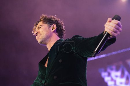 Photo for The singer David Bisbal performs during the concert of I feel alive Tour 2023 at the Wizcenter in Madrid December 6, 2023 Spain - Royalty Free Image