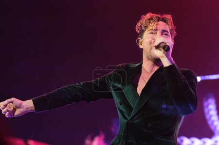 Photo for The singer David Bisbal performs during the concert of I feel alive Tour 2023 at the Wizcenter in Madrid December 6, 2023 Spain - Royalty Free Image