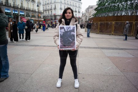 Photo for Dozens of people hold photographs of animals during a demonstration for International Animal Rights Day at Puerta del Sol, on December 9, 2023, in Madrid, Spain. - Royalty Free Image