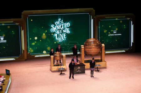 Photo for The children of San Ildefonso sing the lottery balls with the numbers of the Extraordinary Draw of the Christmas Lottery, called 'El Gordo', at the Teatro Real on December 22, 2023 in Madrid, Spain. - Royalty Free Image