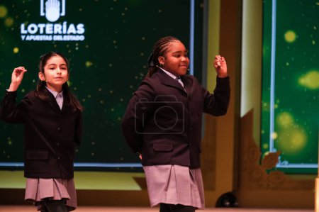 Photo for The children of San Ildefonso sing the lottery balls with the numbers of the Extraordinary Draw of the Christmas Lottery, called 'El Gordo', at the Teatro Real on December 22, 2023 in Madrid, Spain. - Royalty Free Image
