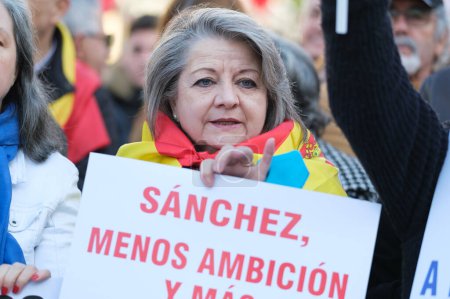 Photo for Hundreds of people during a demonstration in Madrid to show their rejection of the Junts-psoe pact on January 28, 2024 in Madrid, Spain - Royalty Free Image