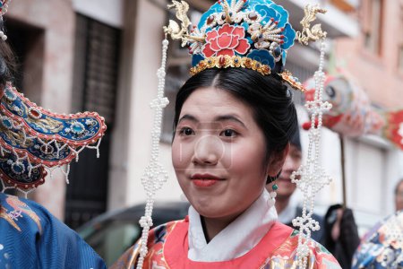 Photo for Several people during the Chinese New Year of the Year of the Dragon parade in the Usera district, on 11 February, 2024 in Madrid, Spain. Yesterday, February 10, 2024 - Royalty Free Image