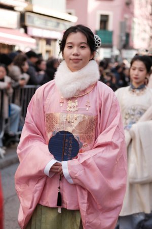 Photo for Several people during the Chinese New Year of the Year of the Dragon parade in the Usera district, on 11 February, 2024 in Madrid, Spain. Yesterday, February 10, 2024 - Royalty Free Image