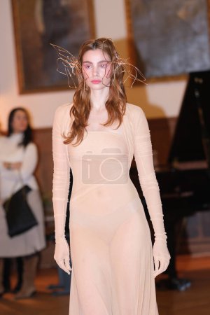 Photo for A model parades with Mara Lafuente design during Mercedes Benz Fashion Week Madrid in Madrid Ateneo 19 of February of 2023 Spain - Royalty Free Image