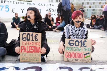 Photo for Protesters during a demonstration against the gag law and police repression in Spain in the Plaza de Colon in Madrid, on February 20, 2024. Spain - Royalty Free Image