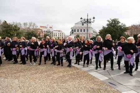 Photo for Women demand equality with a 'flashmob' in front of the Royal Palace on the occasion of International Women's Day, next Friday, March 8, March 4, 2024, in Madrid, Spain. - Royalty Free Image