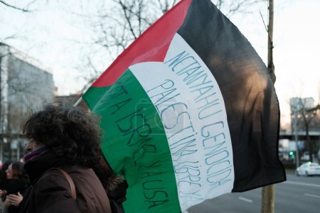 Photo for Several people during the solidarity vigil with the Palestinian people, in front of the headquarters of the European Parliament, on 10 March, 2024 in Madrid, Spain. - Royalty Free Image