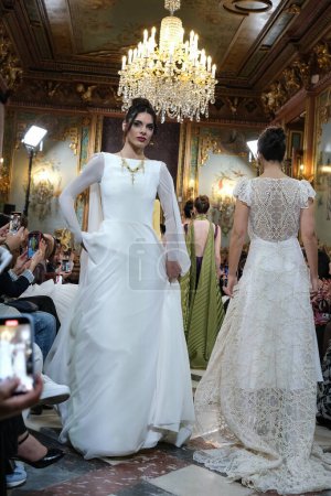 Photo for Model showcases creations by  INMACULADA RODRIGUES during the Atelier Couture bridal catwalk within Madrid Fashion Week, at Santa Isabel Palace in Madrid. marzo, 2024 Spain - Royalty Free Image