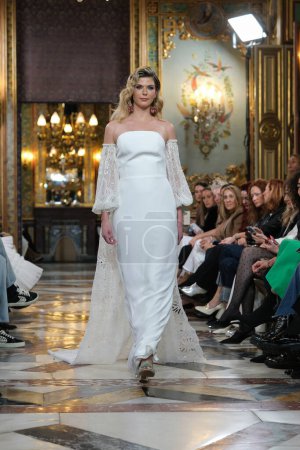 Photo for Model showcases creations by SARA OMATOS during the Atelier Couture bridal catwalk within Madrid Fashion Week, at Santa Isabel Palace in Madrid. marzo, 2024 Spain - Royalty Free Image