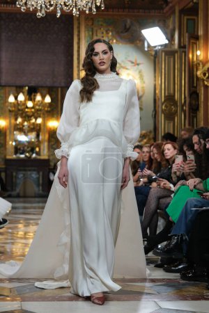 Photo for Model showcases creations by SARA OMATOS during the Atelier Couture bridal catwalk within Madrid Fashion Week, at Santa Isabel Palace in Madrid. marzo, 2024 Spain - Royalty Free Image