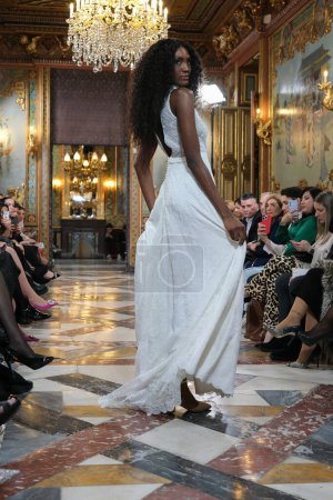 Photo for Model showcases creations by Silvia Fernandez during the Atelier Couture bridal catwalk within Madrid Fashion Week, at Santa Isabel Palace in Madrid. 13 marzo, 2024 Spain - Royalty Free Image